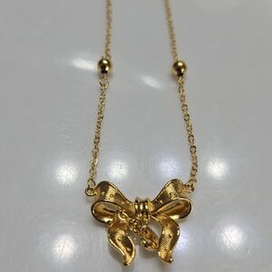 Elegant Gold Bow Necklace